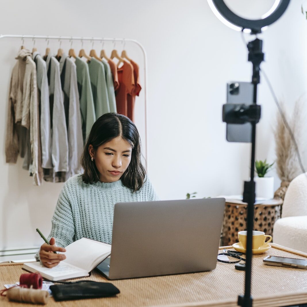 Focused blogger working on project at home