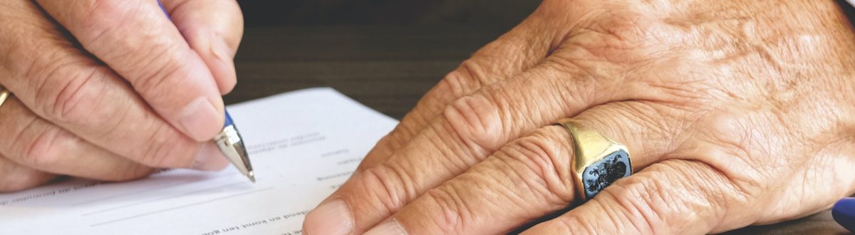 Person Signing Document Paper